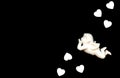 White Cupid with white hearts on black background. Male holiday concept. ValentineÃ¢â¬â¢s Day, Birthday, Wedding greeting or