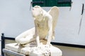 White cupid sculpture, boy statue in vintage