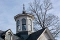 White cupola on top of a decorative victorian style home