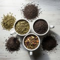 White cups filled with different types of tea leaves are positioned Royalty Free Stock Photo