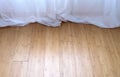 White curtain trailed on a bamboo parquet floor Royalty Free Stock Photo