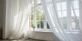 White curtains in a bright room with a window Royalty Free Stock Photo