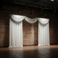 White curtains hang in three sections, draped elegantly over a brick wall backdrop. Royalty Free Stock Photo