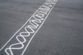 White Curved lines spray paint on tarmac road. street racing concept. Royalty Free Stock Photo