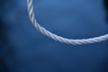 White curvy nylon ropes with blue background