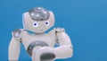 White cute robot moving hands and head