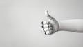 A white cyborg robotic hand making a like gesture, isolated on a gray background. AI robot hand giving thumb up. Copy space