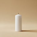 White cylindrical candle standing upright on a smooth, light beige surface, casting a subtle Royalty Free Stock Photo