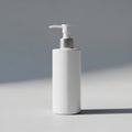 A white cylindrical pump bottle is captured in a well lit space Royalty Free Stock Photo