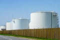 White cylindrical storage tanks for petroleum products Royalty Free Stock Photo