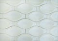 White 3D interior decorative wall panel with unusual geometric shape. Brown metallic background with pattern. Abstract