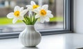 Bright White Daffodils in a Modern Vase by the Window Royalty Free Stock Photo