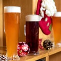 White and dark beer drink glasses, mugs with christmas, new year toys