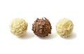 White and dark chocolate candies on white background. Royalty Free Stock Photo