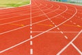 White dash line on red running track Royalty Free Stock Photo