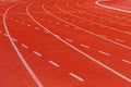 White dash line on red running track Royalty Free Stock Photo