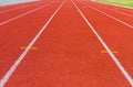 White dash line on red running track Royalty Free Stock Photo