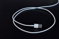 White data cable connector with USB on black background Royalty Free Stock Photo