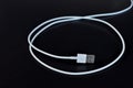 White data cable connector with USB on black background