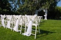 White decorated chairs on a green lawn Royalty Free Stock Photo