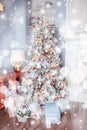 Decorated Christmas tree with many gifts underneath in gentle pastel colors. Good New Year spirit