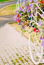 White Decorative Bicycle Parking In Garden