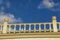 White decorative stone balustrade against the blue sky. Royalty Free Stock Photo