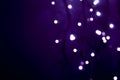 White defocused lights on dark violet background Royalty Free Stock Photo