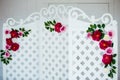 White delicate decorative wood panel in classical interior. Boudoir wedding room. Retro folding screen with flowers