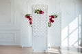 White delicate decorative wood panel in classical interior. Boudoir wedding room. Retro folding screen with flowers