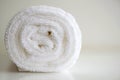 White delicate soft background of plush smooth fabric. Clean white terry towel rolled blanket textile horizontal photo