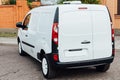 White delivery mini truck stands near building Royalty Free Stock Photo