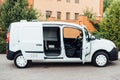 White delivery mini truck stands near building Royalty Free Stock Photo