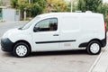 White delivery mini truck stands near building Royalty Free Stock Photo