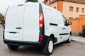 White delivery mini truck stands near building Royalty Free Stock Photo