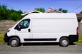 White delivery truck rendering van side view in street Royalty Free Stock Photo