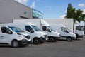 White Delivery Trucks backed Up to logistics retailer Warehouse building Royalty Free Stock Photo