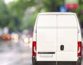 White delivery Van driving fast on city blurr bokeh street