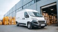 White delivery van parked in front of a warehouse with loading dock. Royalty Free Stock Photo