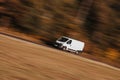 White delivery van on the road in the speed Royalty Free Stock Photo