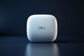 A white dell wireless mouse with a rounded square shape and the dell logo on a dark background Royalty Free Stock Photo