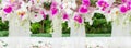 White Dendrobium Orchid and Pink Ginger flower on a wedding aisle. Generative AI