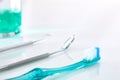 White dentist table with tools and teeth cleaning concept detail