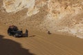 WHITE DESERT, EGYPT - FEBRUARY 6, 2019: Tourist vehicle in El Aqabat (Agabat) valley in the White Desert, Egy