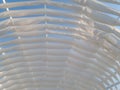 White design strips sheds awning with fabric white curtains on the seashore breeze in the wind outdoor Royalty Free Stock Photo