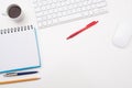 White desk with block note pencil and paperclip