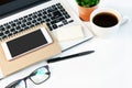 White desk office with laptop, smartphone and other work supplies with cup of coffee. close up ,copy space Royalty Free Stock Photo