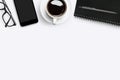 White desk table with office supplies and cup of coffee. Top view with copy space, flat lay Royalty Free Stock Photo
