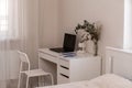 White desktop with laptop for remote work or study. Office computer workplace in home interior Royalty Free Stock Photo