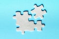 White details of puzzle on a blue background Royalty Free Stock Photo